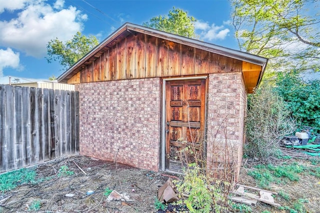 view of outdoor structure featuring fence