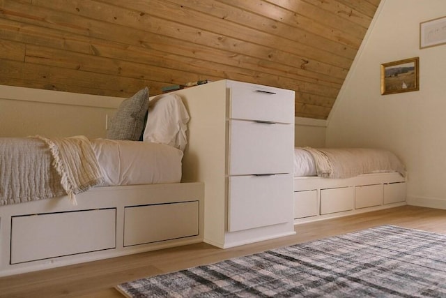 interior space featuring light hardwood / wood-style flooring, wood ceiling, and vaulted ceiling