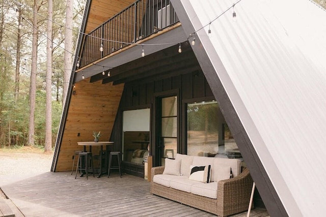 wooden deck featuring outdoor lounge area