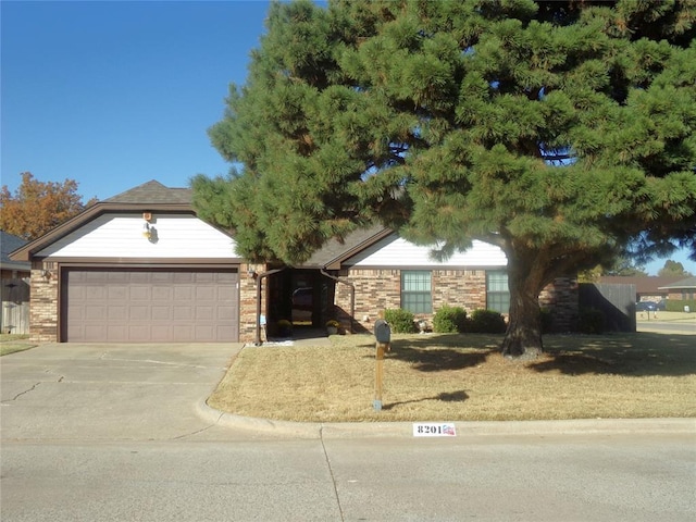 ranch-style home featuring a garage