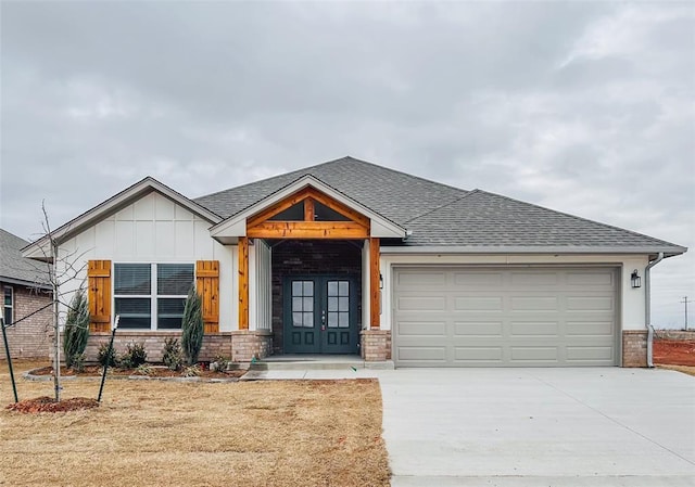 view of front of house with french doors and a garage