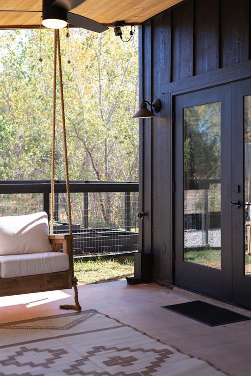 unfurnished sunroom featuring wooden ceiling