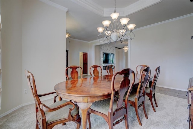 dining room featuring crown molding, light colored carpet, and a notable chandelier