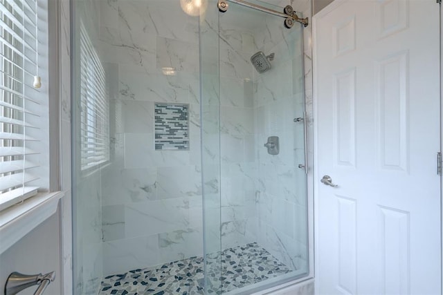 bathroom featuring an enclosed shower