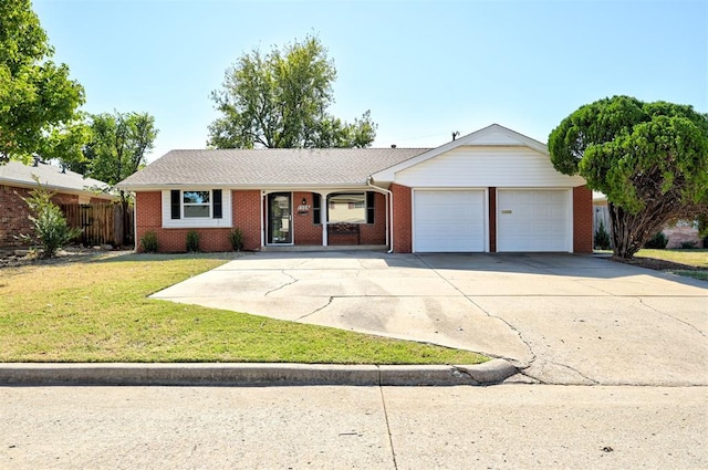 ranch-style house featuring a garage and a front lawn