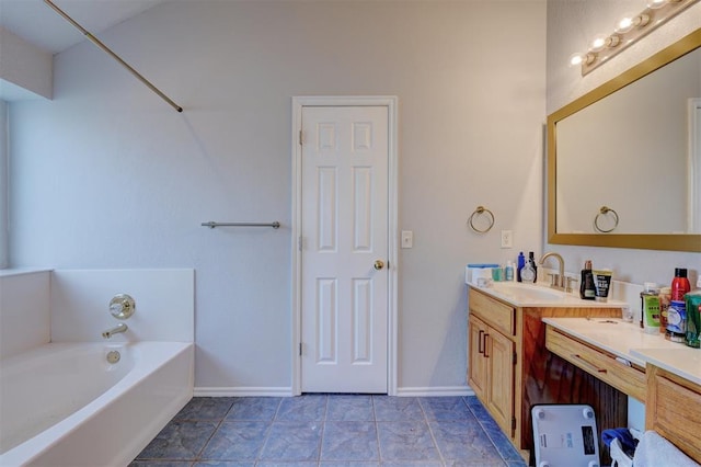 full bathroom with tile patterned flooring, a garden tub, vanity, and baseboards