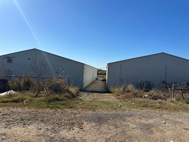 view of side of property featuring an outbuilding