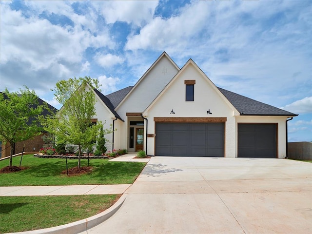 511 Basin Way, Norman, OK 73071 - modern farmhouse featuring driveway, a garage, stucco siding, a front yard, and a shingled roof