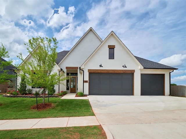 511 Basin Way, Norman, OK 73071 - modern farmhouse with driveway, an attached garage, a front yard, and stucco siding