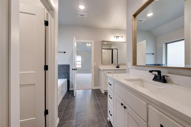 bathroom featuring a sink, visible vents, a bath, and a shower stall