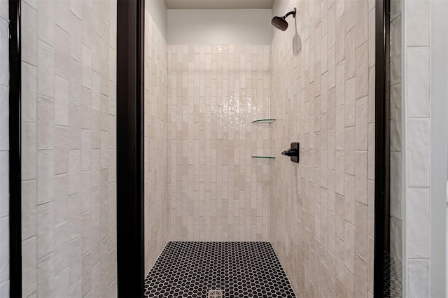 bathroom with tiled shower