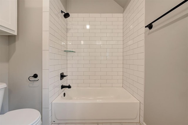 bathroom featuring toilet and shower / bathtub combination