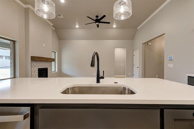 kitchen featuring visible vents, a sink, open floor plan, recessed lighting, and light countertops