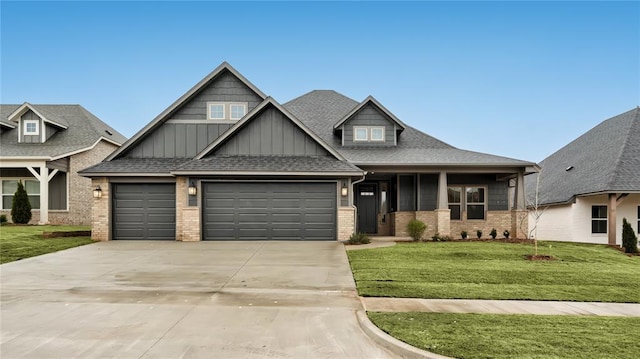 craftsman inspired home featuring a front lawn, an attached garage, brick siding, and concrete driveway