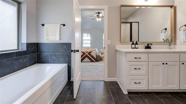 ensuite bathroom with vanity, a bath, ensuite bathroom, and ceiling fan