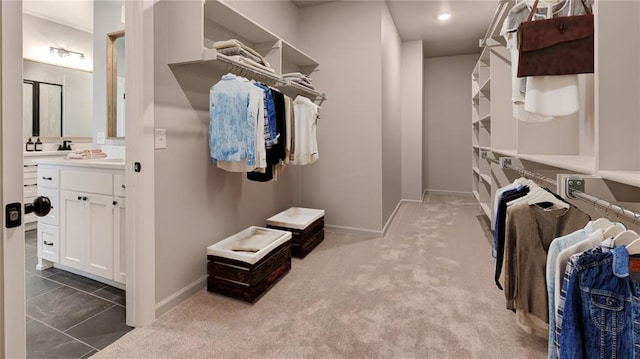 spacious closet with carpet flooring