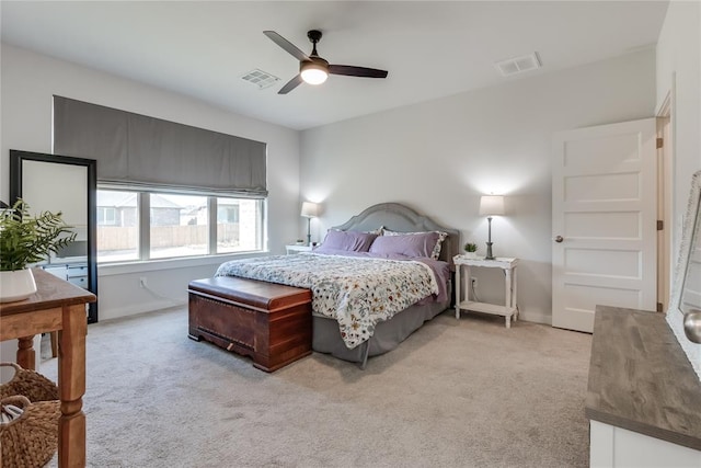 bedroom with ceiling fan and light carpet