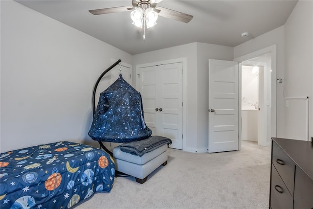 bedroom featuring light carpet and ceiling fan