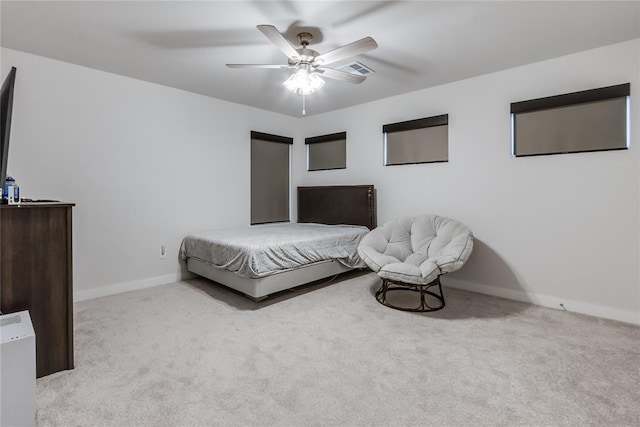 bedroom featuring light carpet and ceiling fan