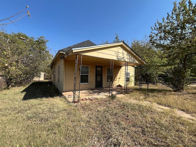 rear view of property featuring a patio