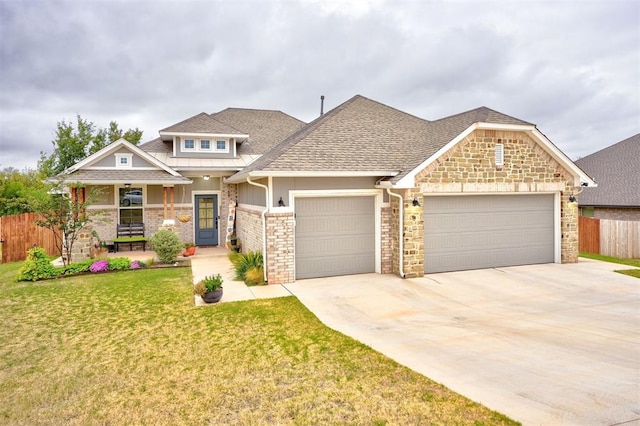 craftsman inspired home featuring a porch, a garage, and a front yard