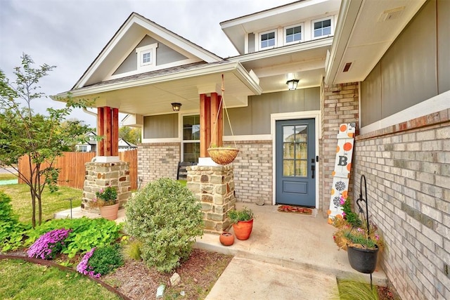 view of exterior entry featuring a porch