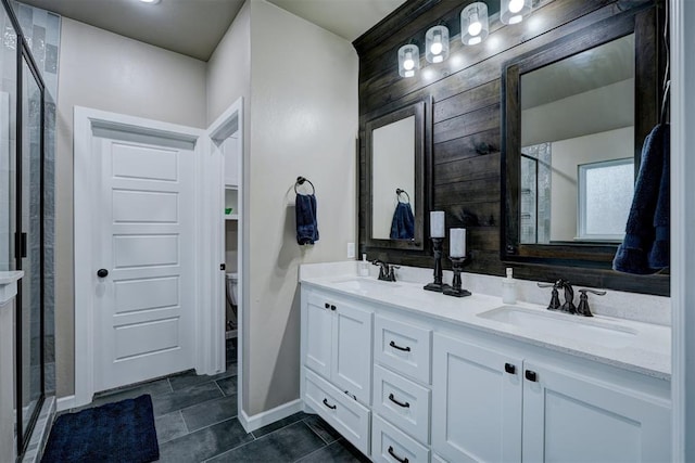 bathroom featuring tile patterned floors, vanity, and walk in shower