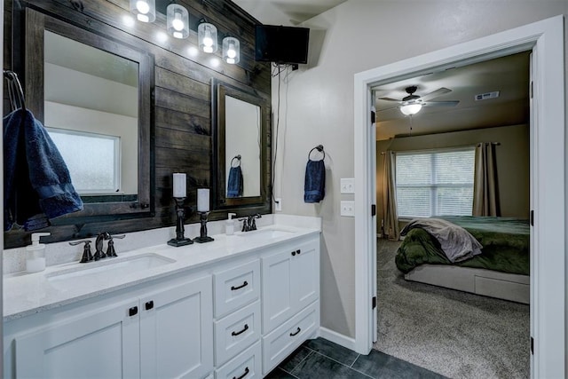 bathroom featuring tile patterned floors, vanity, and ceiling fan