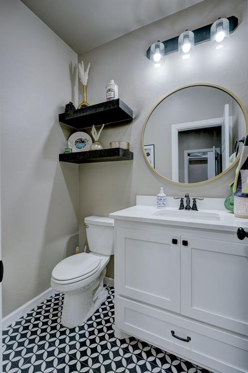 bathroom with vanity and toilet