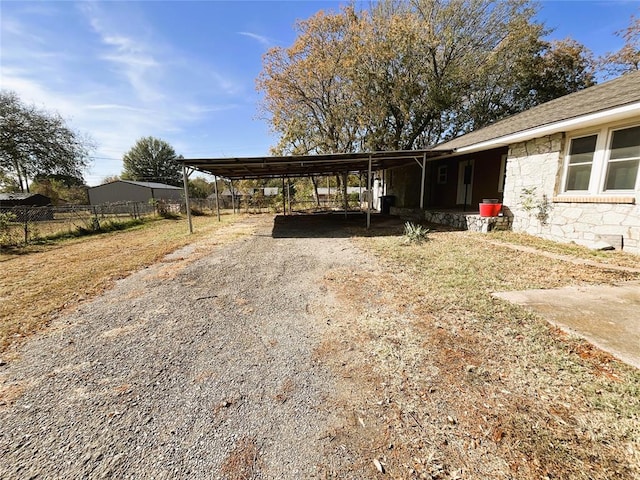 exterior space with a carport