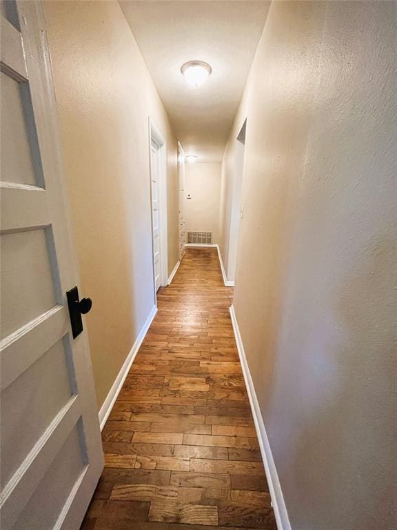 hallway featuring hardwood / wood-style floors