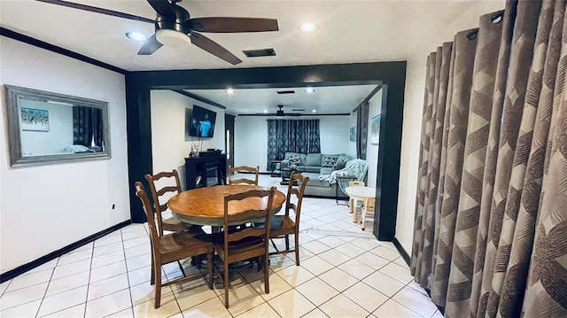 dining area featuring light tile patterned floors and ceiling fan