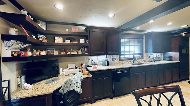 kitchen with light stone countertops, sink, light tile patterned floors, and black dishwasher