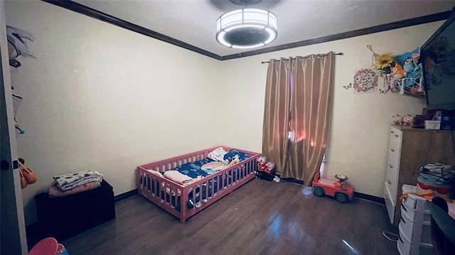 bedroom featuring dark hardwood / wood-style flooring and ornamental molding