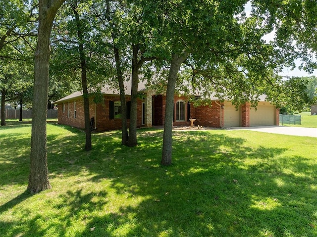 ranch-style house with a front yard and a garage