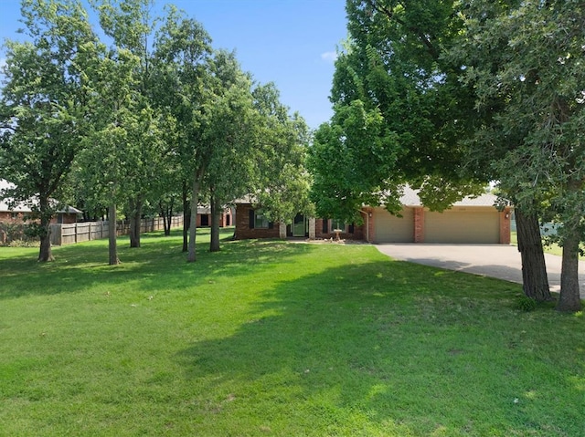 view of front facade with a garage and a front lawn