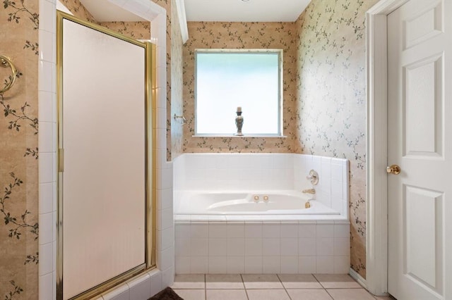 full bathroom featuring tile patterned floors, a shower stall, a bath, and wallpapered walls