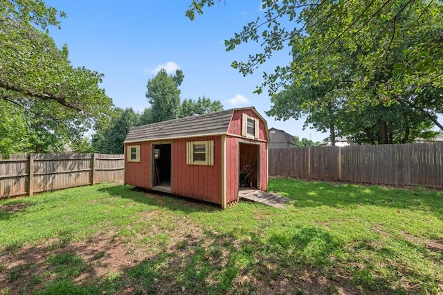 view of shed with a fenced backyard