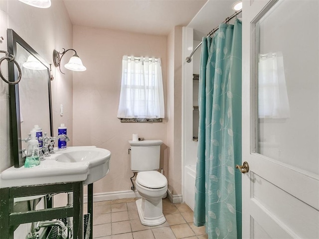 bathroom with toilet, shower / bathtub combination with curtain, and tile patterned floors