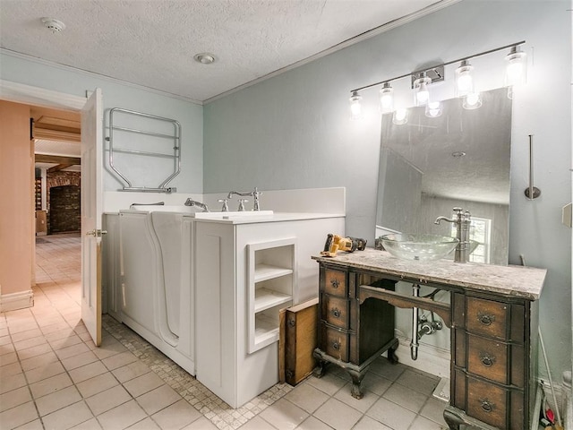 bathroom with vanity, tile patterned flooring, and a textured ceiling