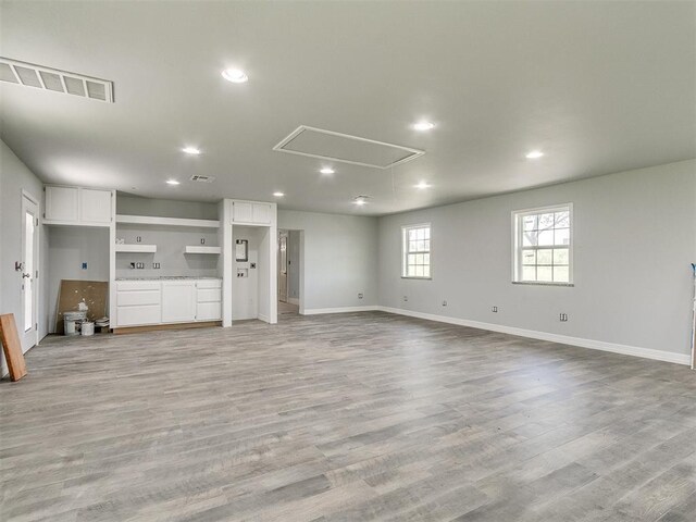 unfurnished living room featuring light wood-type flooring