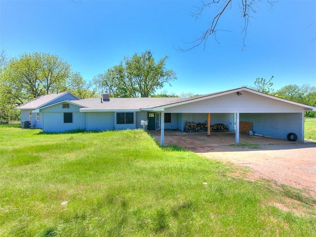 ranch-style house with a front lawn and a carport