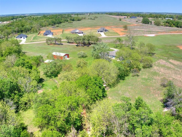 birds eye view of property featuring a rural view