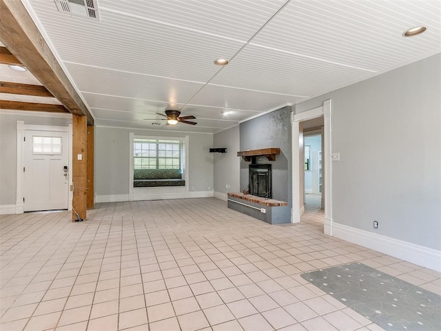 unfurnished living room with ceiling fan and light tile patterned floors