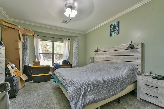 carpeted bedroom featuring ceiling fan and ornamental molding