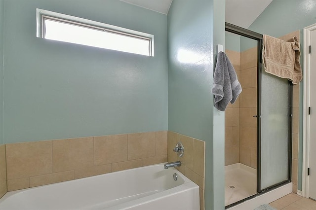 bathroom with separate shower and tub and tile patterned floors