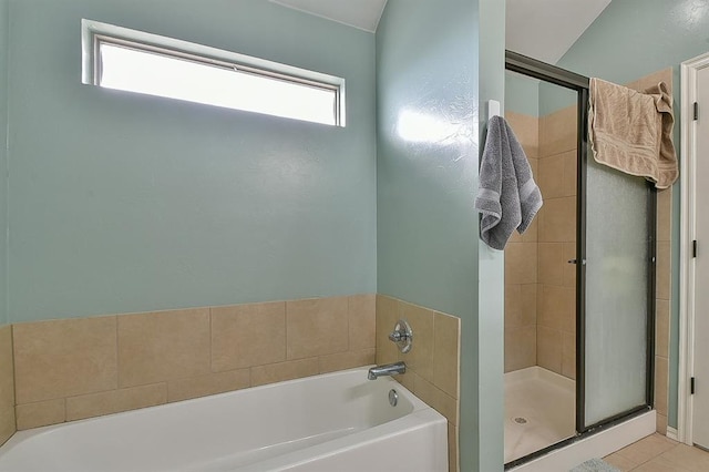7301 Morning Song Dr, Oklahoma City, OK 73150 - bathroom featuring a bath, a stall shower, and tile patterned flooring