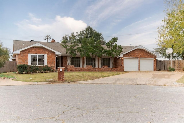 ranch-style home with a front yard and a garage