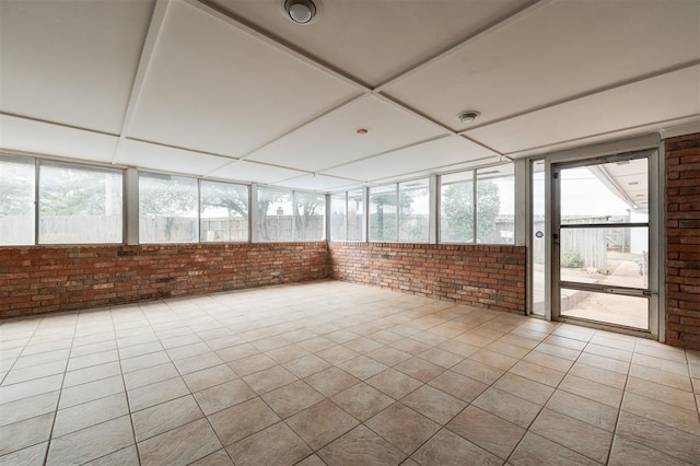 unfurnished sunroom with a healthy amount of sunlight