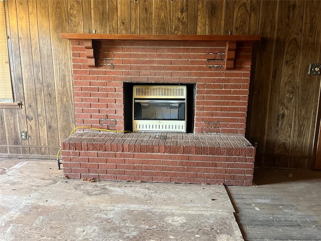 room details featuring heating unit and wooden walls